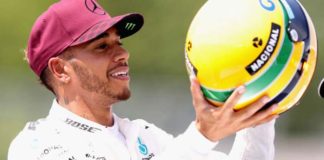 Lewis Hamilton with Senna's helmet