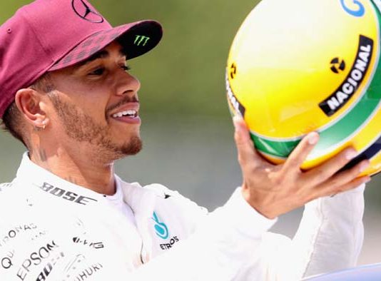 Lewis Hamilton with Senna's helmet